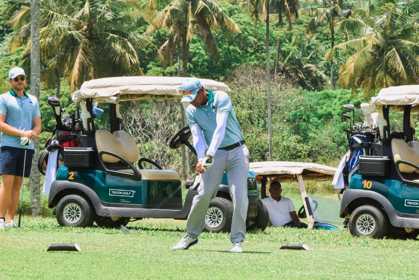 A player mid-swing at the Maldives Open 2025