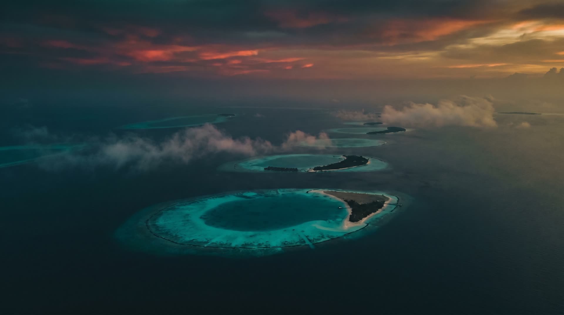 Maldivian atolls from the air at dusk